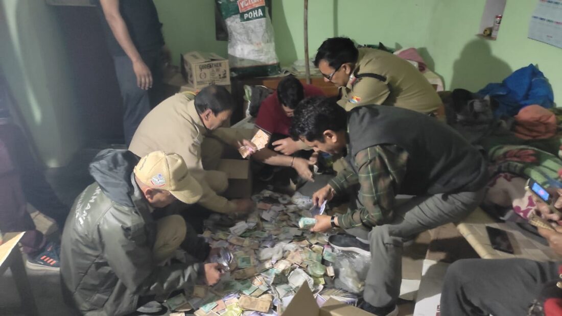 Police Raid: House raided in search of liquor...! Found a hoard of 'notes'...the team had to sit on the ground and count...see VIDEO