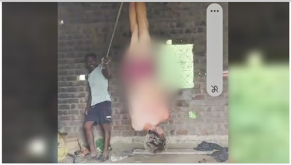 Current in Private Parts: Terrible torture given to a young man...! He was stripped naked and hung upside down and given electric shock in his private parts... watch the video here