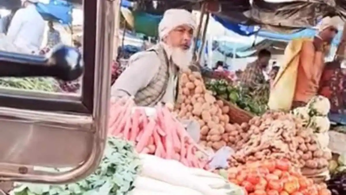 Dirty Shopper: A dirty shopkeeper from a particular community sitting at his shop spit on the vegetables... watch the viral video here